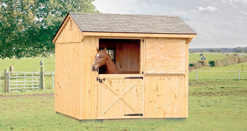 common size one stall horse barn shown with wood siding and shingle roof